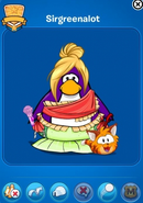 Sirgreenalot, a Club Penguin staff member, seen walking the Orange Tabby Cat