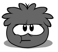 A Black Puffle chewing Puffle Bubble.