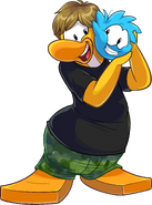 As seen in issue 424 of the Club Penguin Times, along with the Black T-Shirt