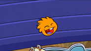 An Orange Puffle jumping into the pool in the Puffle Play Zone