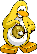 A yellow penguin hitting a gong