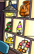 As seen on display in the Clothes Shop, along with the Blue Shirt, Christmas Scarf, Party Hat, Hawaiian Lei, and Gold Viking Helmet