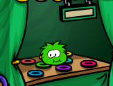 A Green Puffle at the Feed a Puffle game booth.