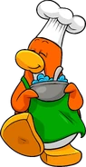 CPT 209 cake chef.png (283 KB) As seen in issue 209 of the Club Penguin Times, along with the Coffee Apron
