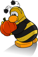 As seen in issue 259 of the Club Penguin Times, along with the Bee Costume