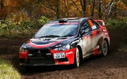 The Lancer Evo X driven by Fumio Nutahara in Rally Japan.