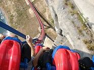 The ride's opening drop over the quarry wall.