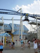 Roller Soaker's car being splashed with water cannons.