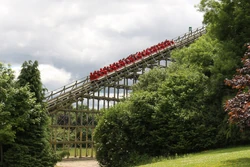 The red train climbing the first lift hill.