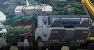 The rocket being outfitted onto the truck.