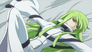 C.C. lying on Lelouch bed