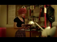 Aelita looking at a photo of her with Anthea.