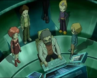 Working on the Supercomputer as the gang watch him