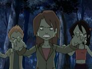She's the one in the middle. She's not normally a zombie.