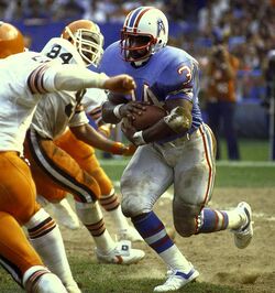 Running back Earl Campbell of the Houston Oilers looks on during