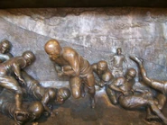 Relief of Nile Kinnick's famous touchdown against the University of Notre Dame in south end of the stadium.