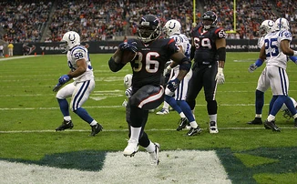 Ron Dayne celebrating after rushing a touchdown against the Colts in 2006.