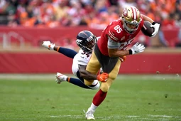 Will Parks (wearing 34) tackling George Kittle in 2018.