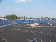 The site where Atlanta-Fulton County Stadium once stood is now a parking lot for Turner Field. The fence and wall display in the center of the picture commemorates the spot at which Hank Aaron's 715th home run landed on April 8, 1974.