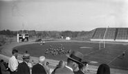 Folsom Field between 1933 and 1950. The team is practicing in the North end of the field.