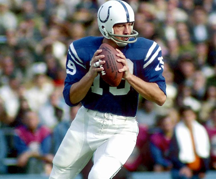 Quarterback Johnny Unitas (19) of the Baltimore Colts runs to pick up  yardage against the Chicago Bears during the first quarter of their game in  Chicago, Ill., Nov. 13, 1960. Making the