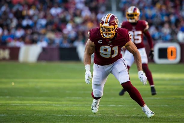 Philadelphia Eagles defensive end Ryan Kerrigan (90) warming up on the  field before the start of the first half of an NFL football game, Sunday,  Jan. 2, 2022, in Landover, Md. (AP