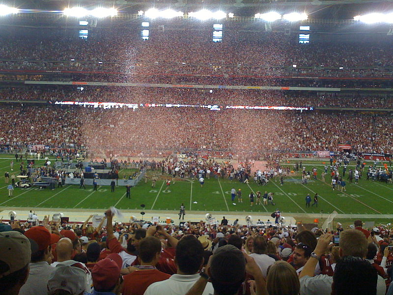 Dallas Cowboys quarterback Tony Romo looks back at the Arizona Cardinals  celebration after blocking a Cowboys punt in overtime for a touchdown to  defeat the Cowboys 30-24 at University of Phoenix Stadium