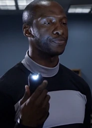 Security GuardOne of the Threes who provided security for the Talent show. He ejected Parker Deay after his fellow Three was downvoted and later blocked Britta from entering a Five area by brandishing a stun gun.