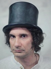 Black top hat of Star Burns (Dino Stamatopoulos) in Community (S01E17)