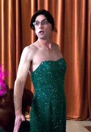 Dean Pelton changed into this green dress to participate in a Tango competition with Jeff for the "Hunger Deans" competition. Appearance: "History 101"