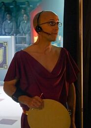 Dean Pelton wore this mandated futuristic "Four" uniform to reflect his status in the "MeowMeowBeenz" society.Appearance: "App Development and Condiments"