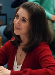 Annie wore this red sweater while helping Troy study for Astronomy. Appearance: "Football, Feminism and You"