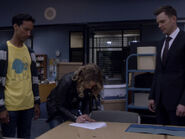 5x01-Britta signs Abed Jeff