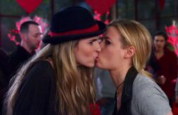 Paige and Britta kiss