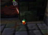 A Tedi shooting Conker with the machine gun.