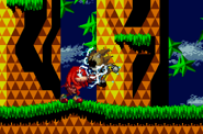 Knuckles hitting Queen with his electric gloves.