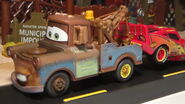 Mater towing Lightning McQueen