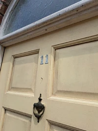 Front door of No
