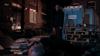 Phelan watches Michael as he dies