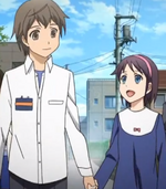 Satoshi and Yuka walking to school hand-in-hand.