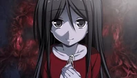 Sachiko holding her Calavera Necklace