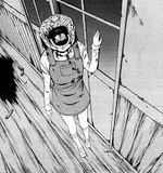 Tokiko walking by the wall