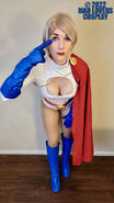 Geneviéve Reneé again as PowerGirl, this time in the familiar "my eyes are up HERE" pose.