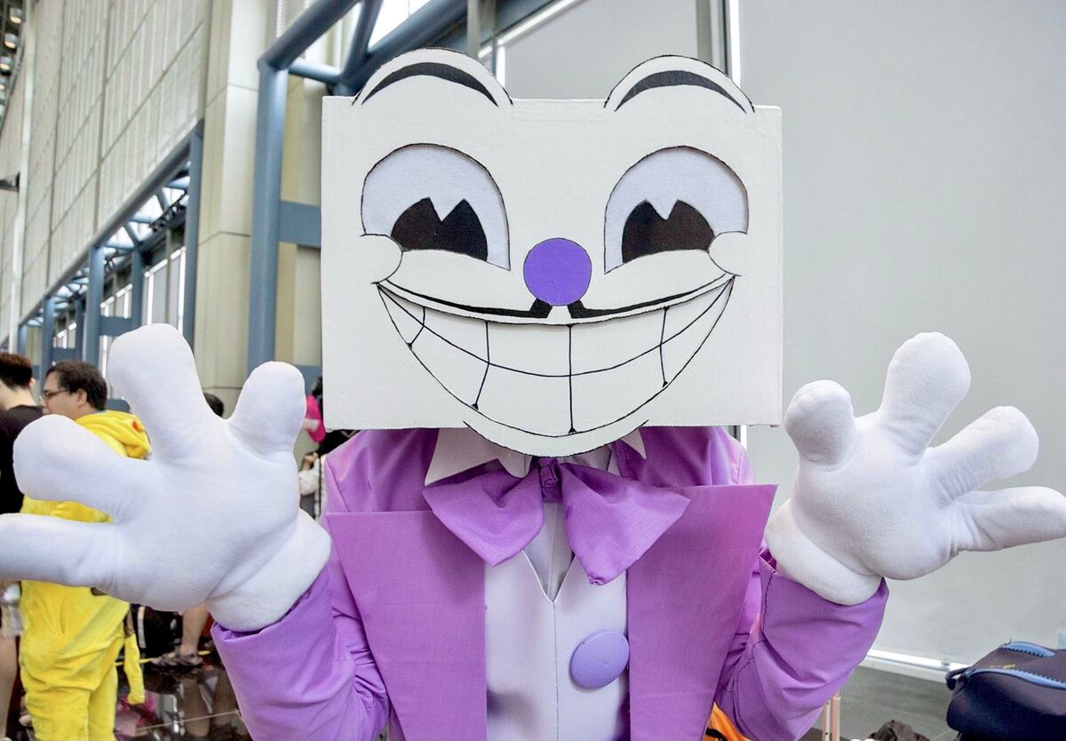 A cosplayer dressed as King Dice from the video games Cuphead