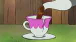 Tilly pours tea into a cracked teacup