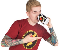 Aleks posing for merch