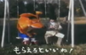 Japanese Crash sitting on a swing with a man in the Japanese Crash 2 commercial.