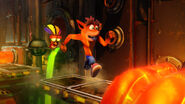Aku Aku with Crash in a gameplay still from Heavy Machinery in the N. Sane Trilogy.