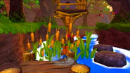 Crash hiding from a tribesman behind some reeds in the River Rollerbrawl segment.