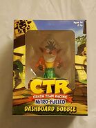 A hula Crash figurine given as a bonus for pre-ordering the game.